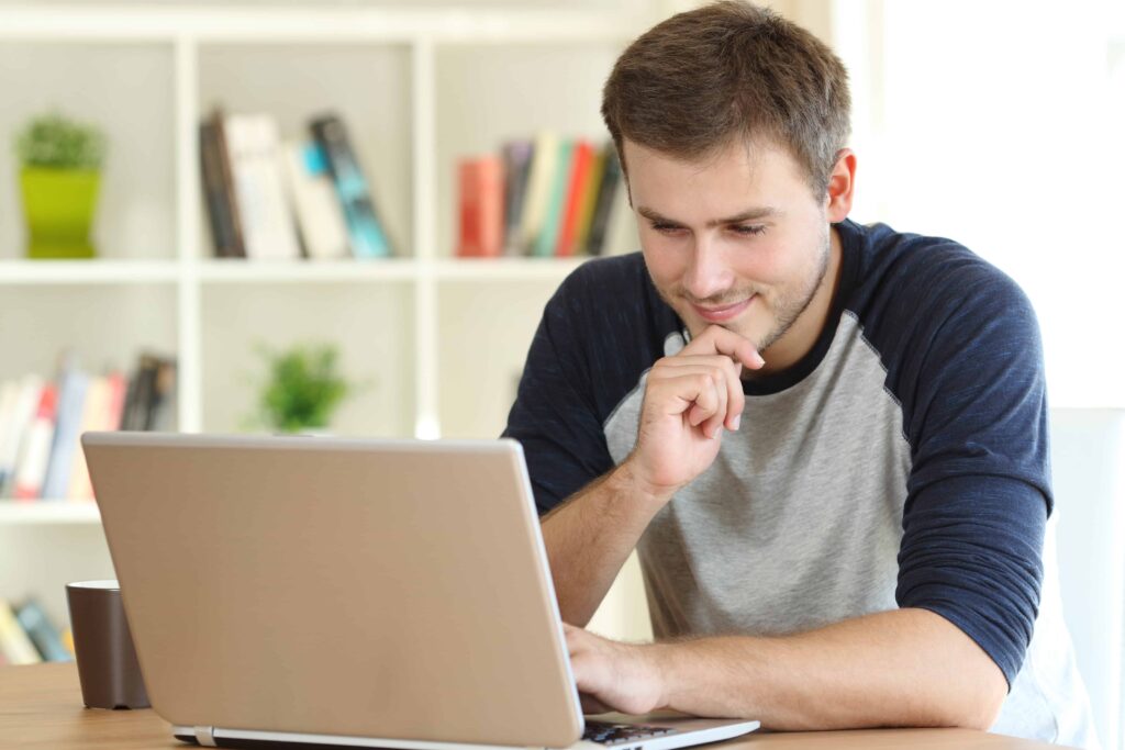A person reading an article on laptop about what is high - quality content for seo