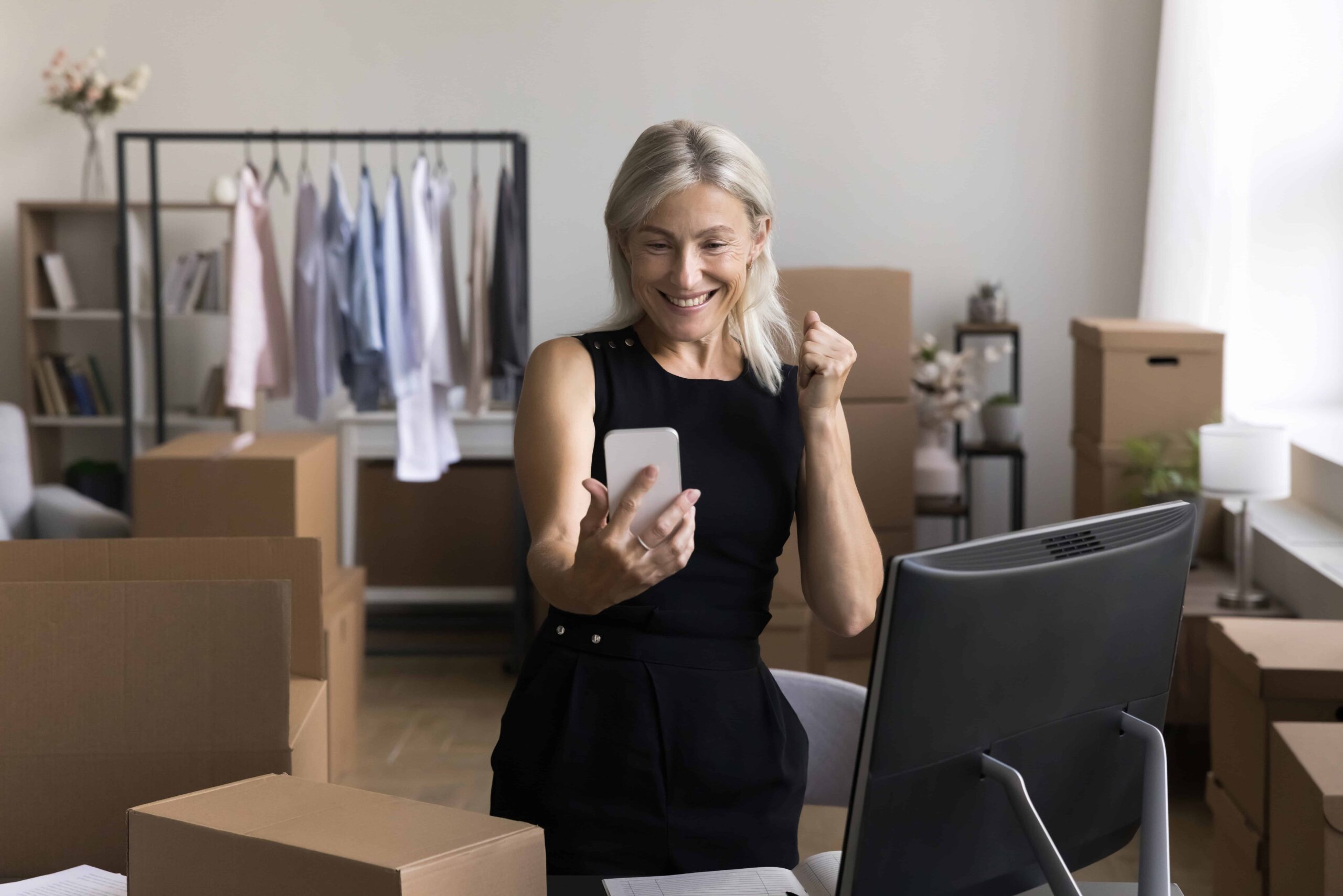 Business woman celebrating good results with inexpensive SEO services